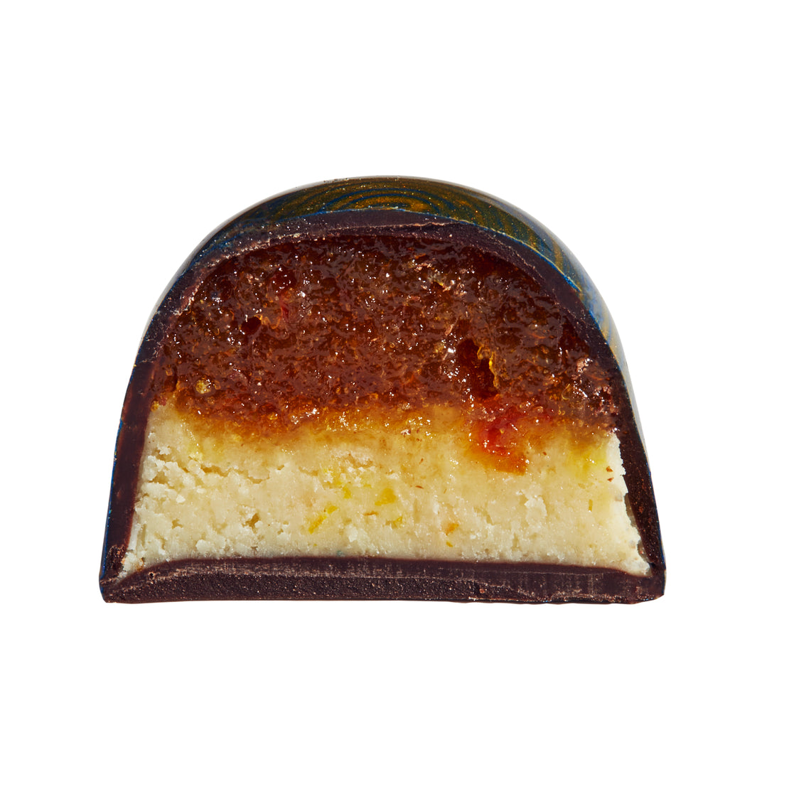 Half-section view of a chocolate bonbon with a marmalade cookie flavor.