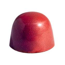 The exterior of a chocolate bonbon with poached pear flavor.